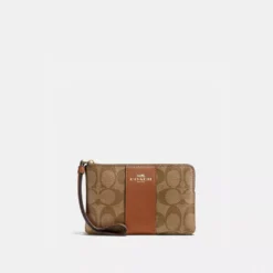 Coach Corner Zip Wristlet In Signature Canvas