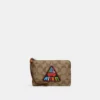 Coach Corner Zip Wristlet In Signature Canvas With Patch