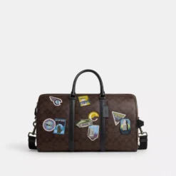 Coach Venturer Bag In Signature Canvas With Travel Patches
